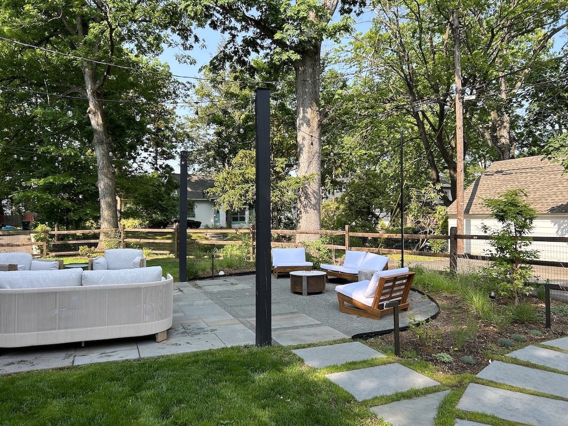 Harita back patio with stepping stones and firepit in northern nj backyard.jpg