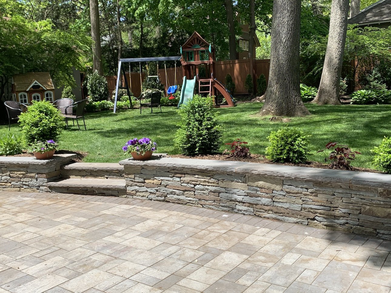 Natural stone wall with greenery in nj springtime.JPG