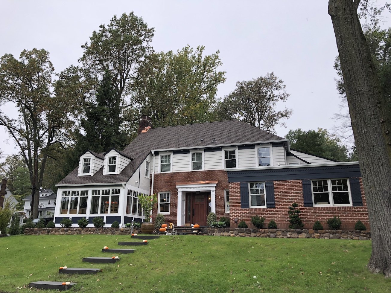 Stone front entrance walkway with shrubs and native plantings outside home in northern NJ.jpg