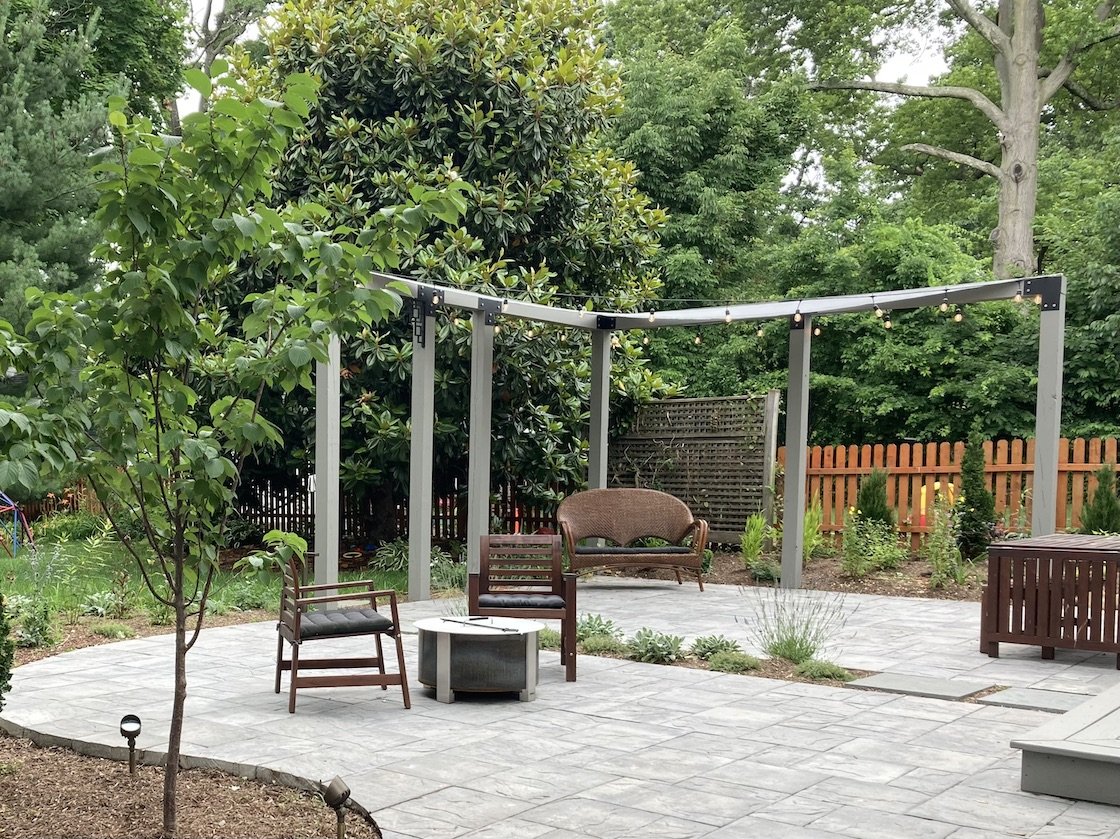 Backyard patio with pergola and italian lights.jpg